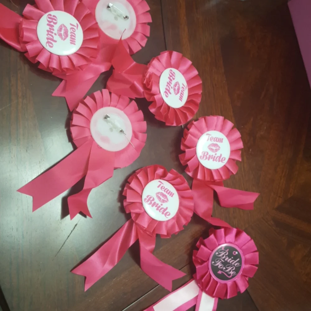 Team bride. Cups and lapel pins.